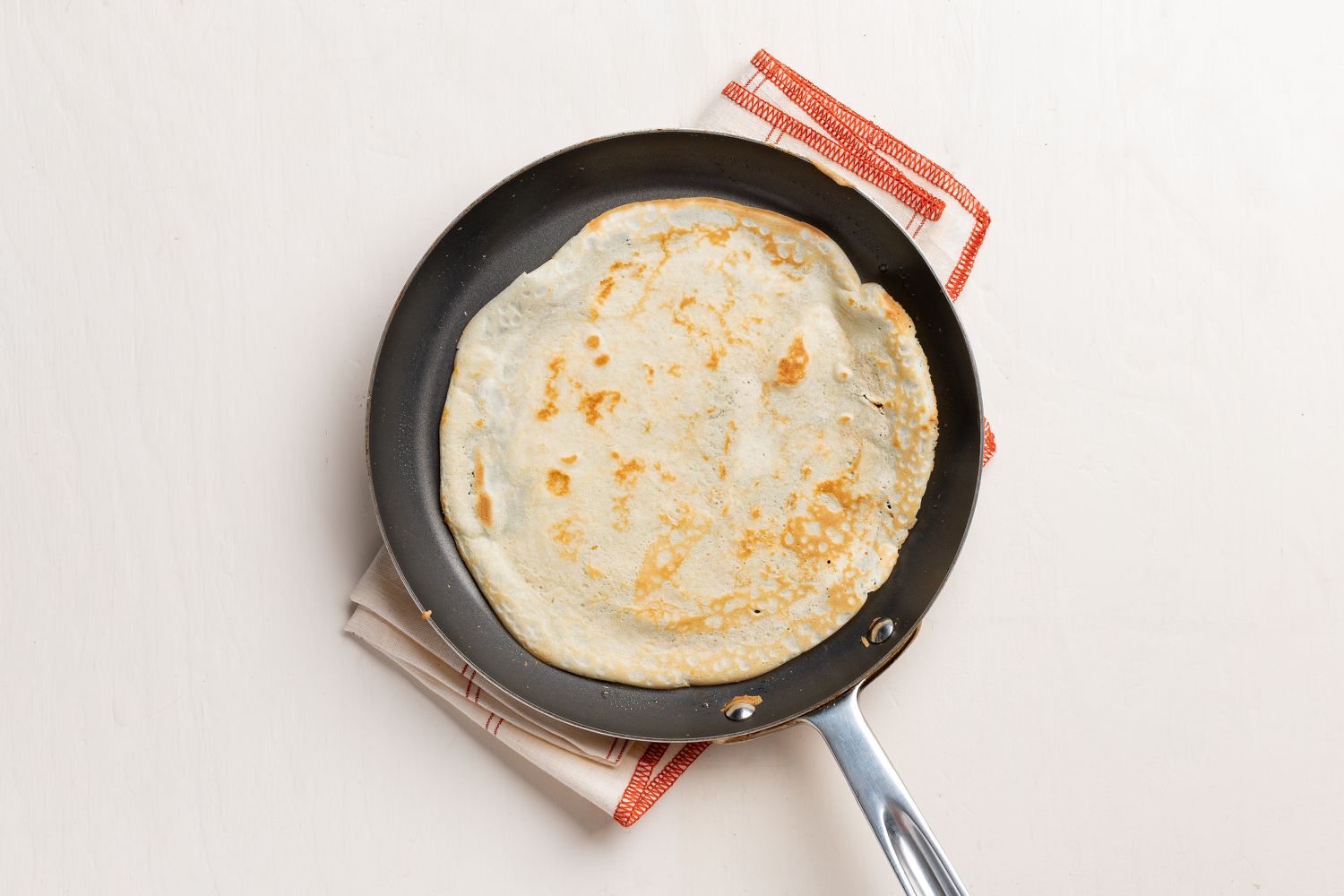 one cooked crepe for simple crepes recipe step 4