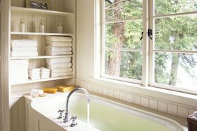 cream bathroom with shelves