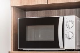 Modern Microwave in kitchen cupboard