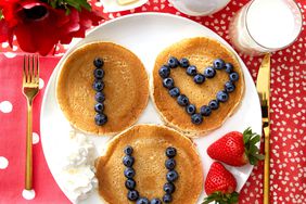 Pancakes with blueberries and strawberries for valentines day