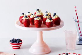 filled strawberries on cake platter