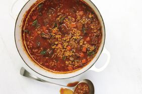 fit to eat beef soup in a white pot with silver ladle