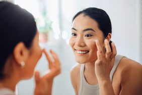 Woman applying foundation