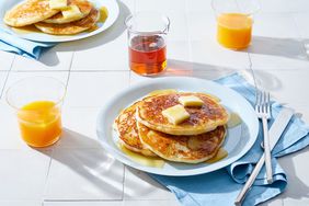 gluten free buttermilk pancakes on white plate at breakfast