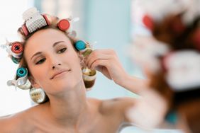 Woman wearing hot rollers