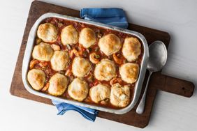 Dumplings gumbo in pan on cutting board