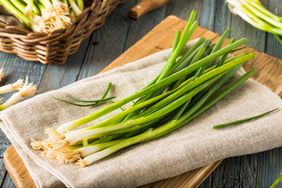 Green onions on cutting board