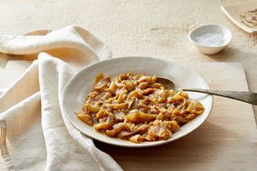 instant pot caramelized onions in a bowl with spoon