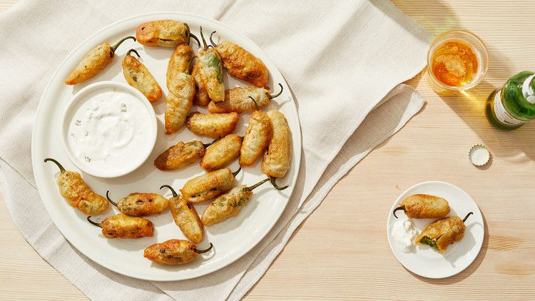 jalapeno poppers on plate with dip