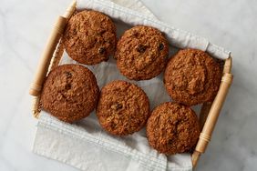 six bran and raisin muffins in a basket