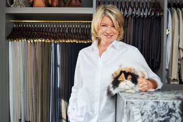 portrait of martha stewart in closet with her cat