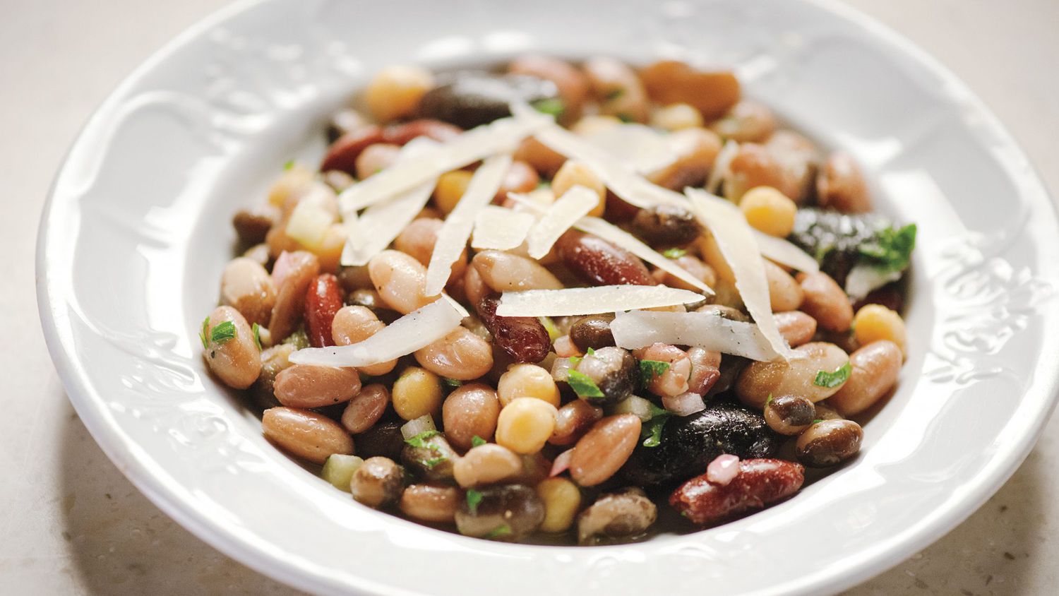 seven bean salad in white bowl