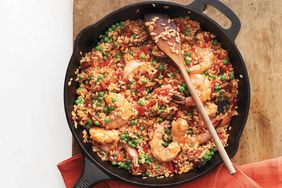 skillet rice chorizo shrimp with wooden spoon