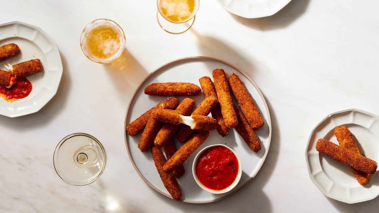 homemade mozzarella sticks on round platter