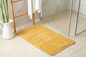 Bathroom with yellow bathmat