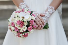 Bride wearing lace, fingerless gloves