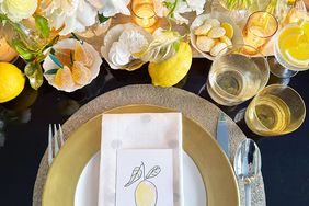 Table setting with lemon name cards and florals