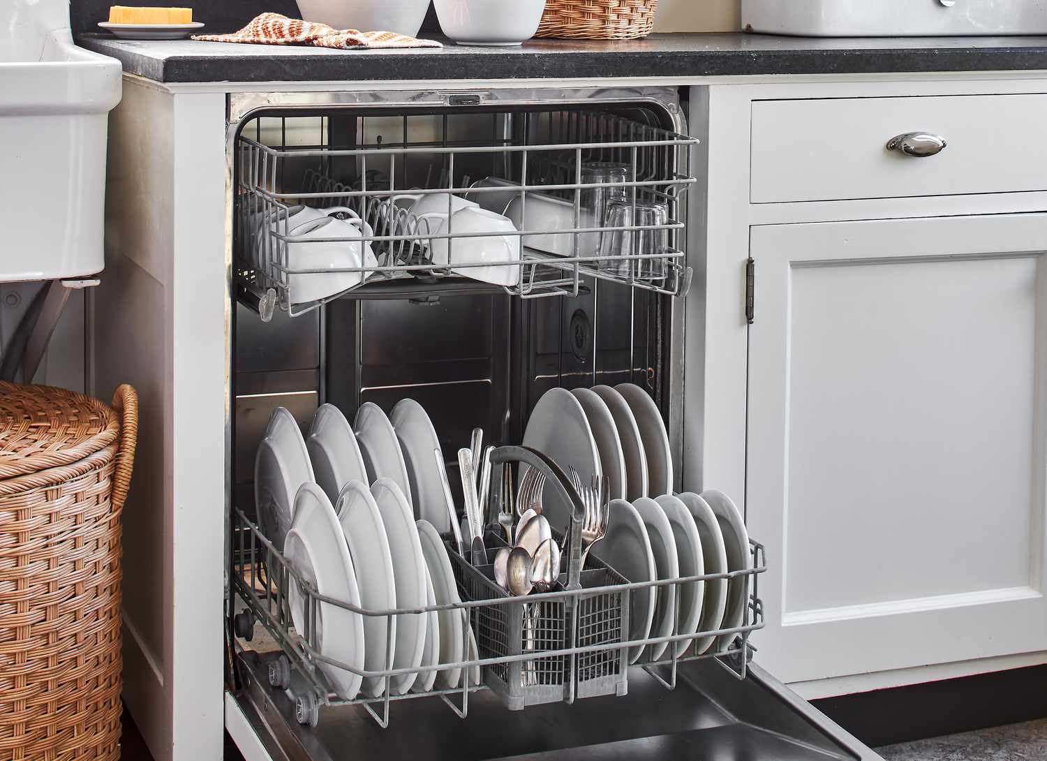 open dishwasher in a white kitchen