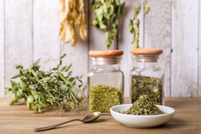 Dried herbs in jars and dish