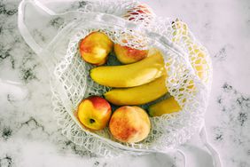 Banana and pears in mesh bag