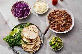 instant pot carnitas with tortillas, avocado, and cabbage