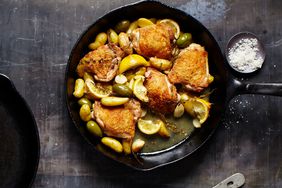 overhead view of lemon chicken skillet on a dark surface