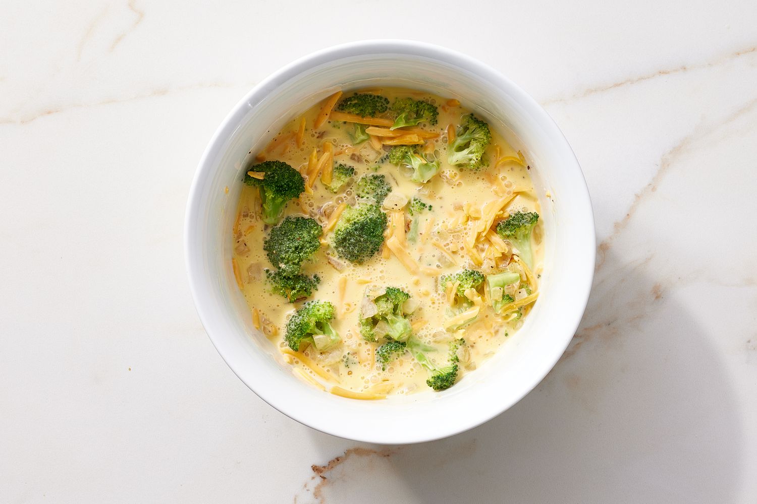 Bowl of Broccoli Cheddar Quiche mixture