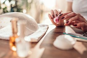 Woman removing nail polish