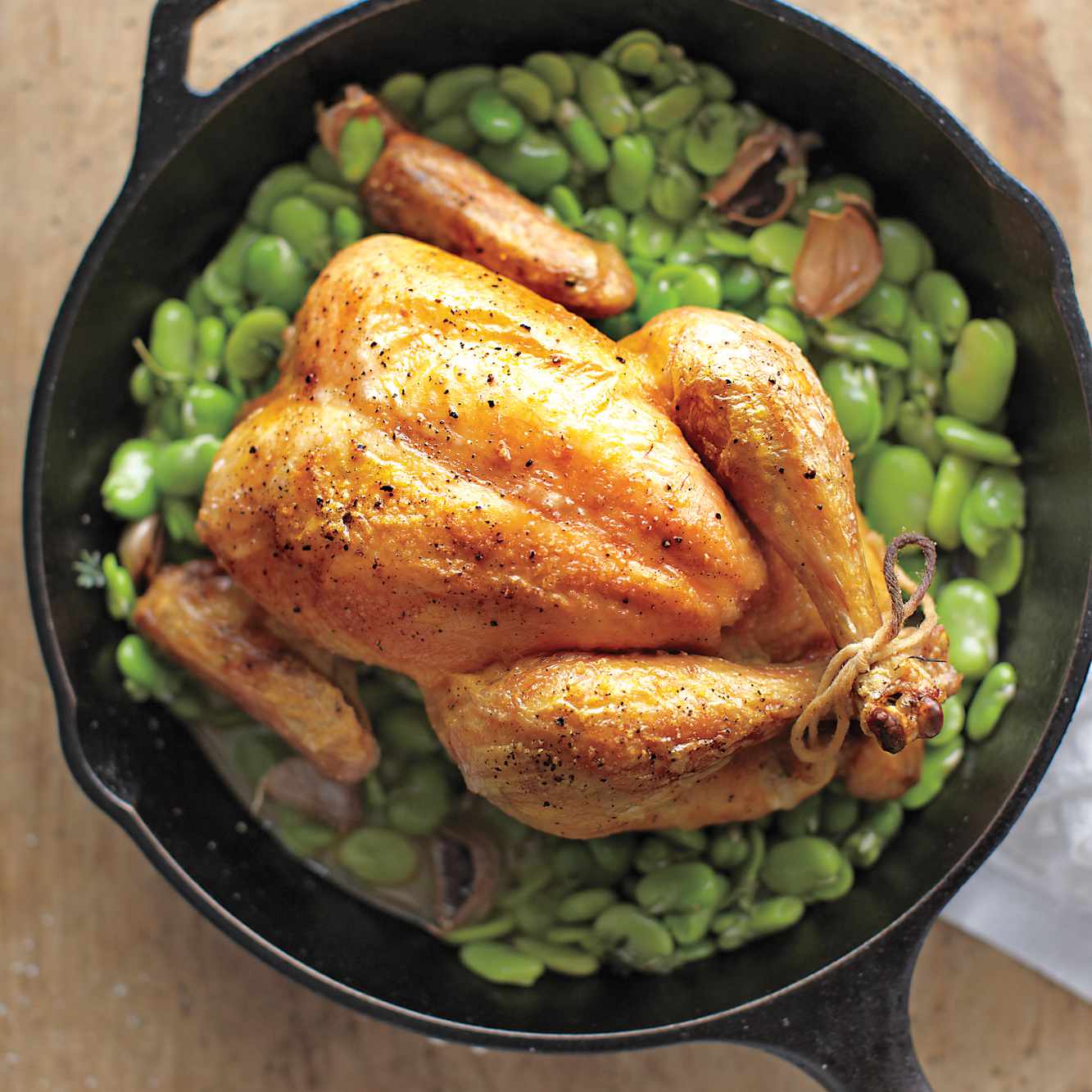 Rotisserie chicken on fava beans