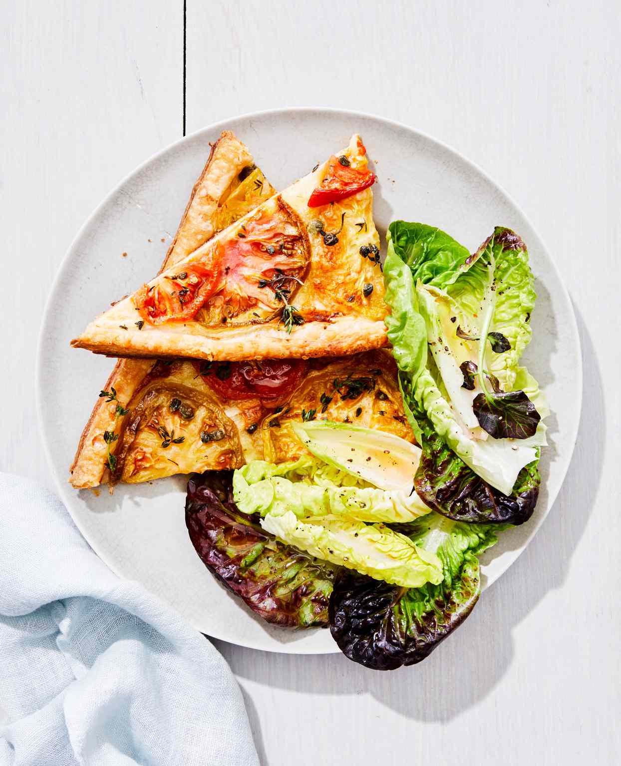 side salad with tomato and brie tart