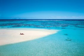 couple lounging on beach