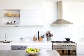 white kitchen with stainless steel appliances