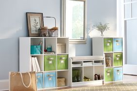 white shelving with green and blue colored storage bins