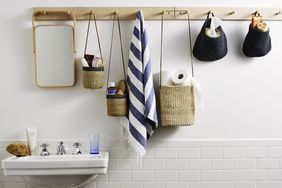 Various toiletries hanging on white wall