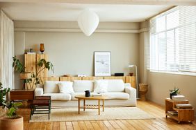 Sofa with coffee table by window in living room. 